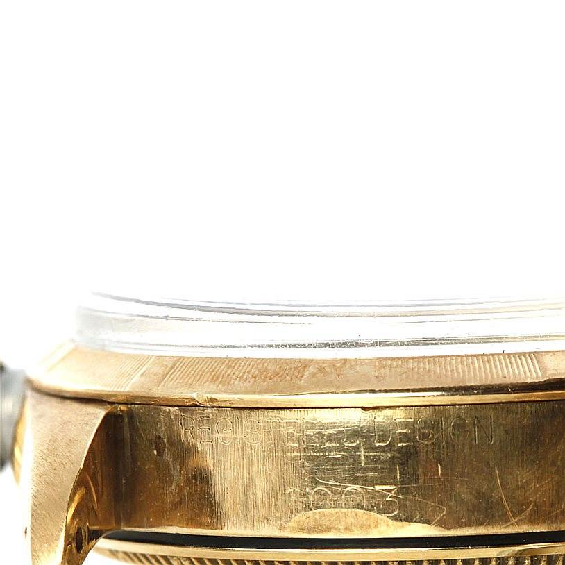 The image shows a side profile of the case and bezel of a Rolex Vintage Collection 1003 Yellow Gold Silver Dial 1003 Yellow Gold Silver Dial model watch.