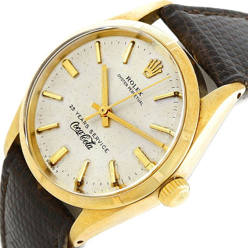 The image shows a Rolex Vintage Collection 1003 Yellow Gold Silver Dial 1003 Yellow Gold Silver Dial model watch at a slight side angle, displaying the dial, crown, and part of the strap.