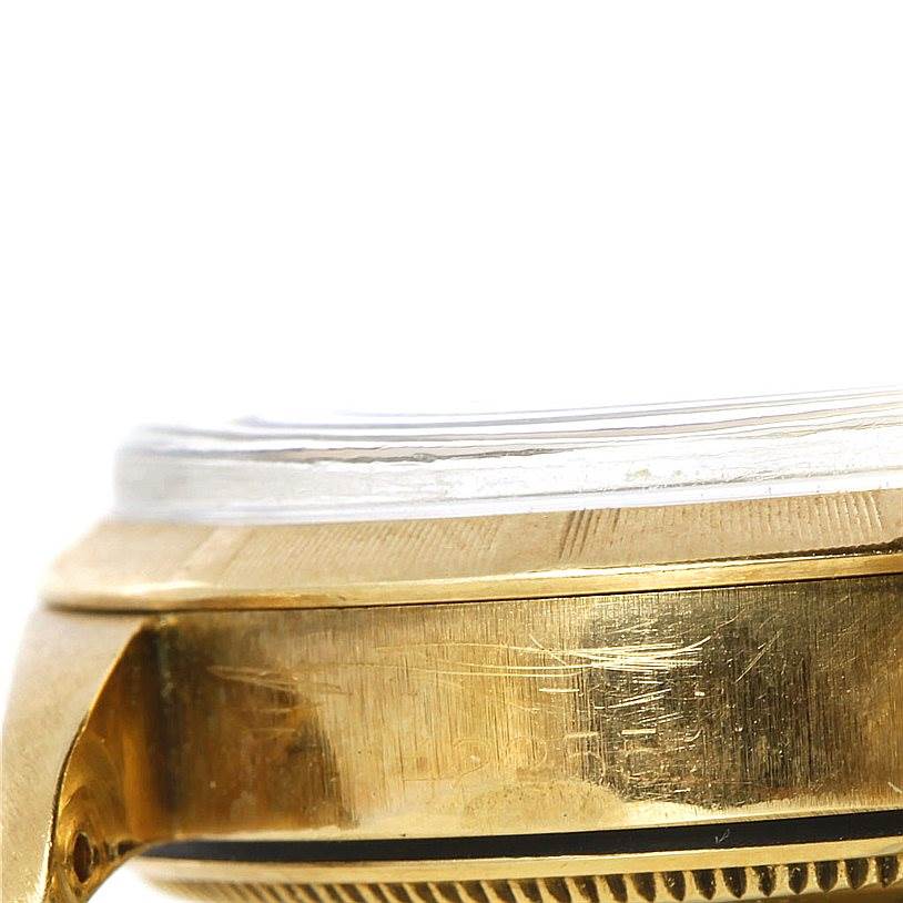 The image shows a close-up side view of the case and bezel of a Rolex Vintage Collection 1003 Yellow Gold Silver Dial 1003 Yellow Gold Silver Dial watch.
