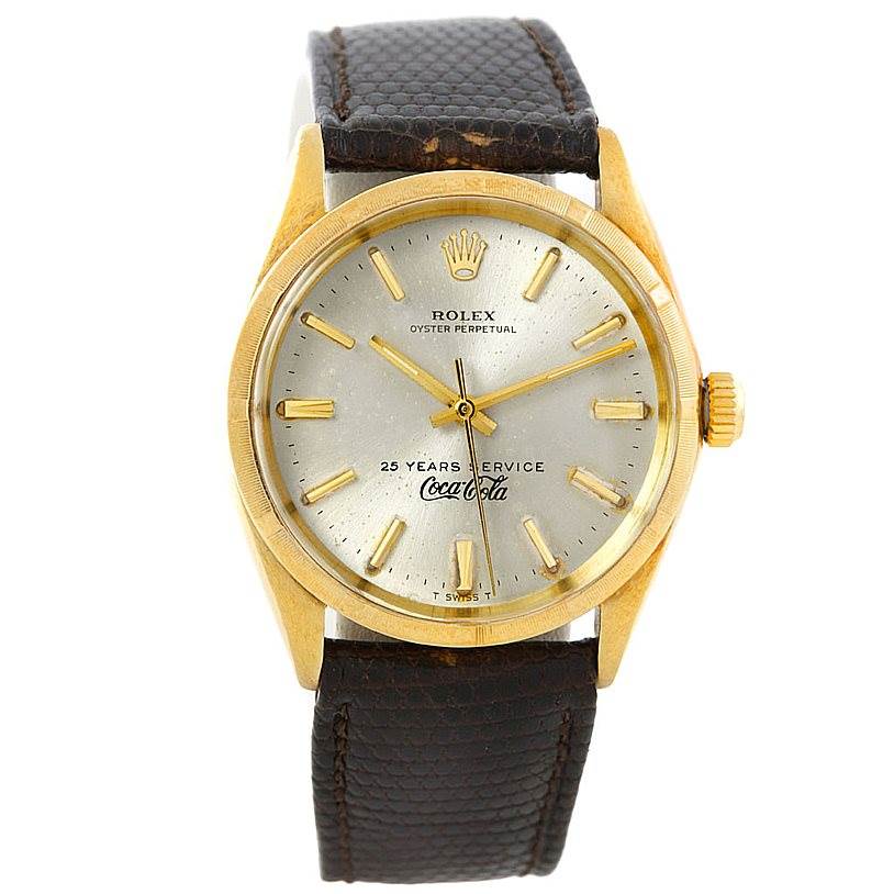 The image shows a front view of a Rolex Vintage Collection 1003 Yellow Gold Silver Dial 1003 Yellow Gold Silver Dial watch, highlighting its golden bezel, dial, and brown leather strap.