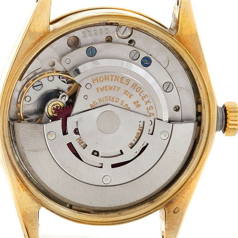 The image shows the internal mechanism of a Rolex Vintage Collection 1003 Yellow Gold Silver Dial 1003 Yellow Gold Silver Dial watch viewed from the back.