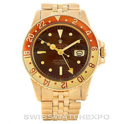 This image shows a frontal view of a Rolex Vintage Collection 1675 Men's Yellow Gold Brown Dial 1675 Men's Yellow Gold Brown Dial watch, highlighting its face, bezel, bracelet, and date window.