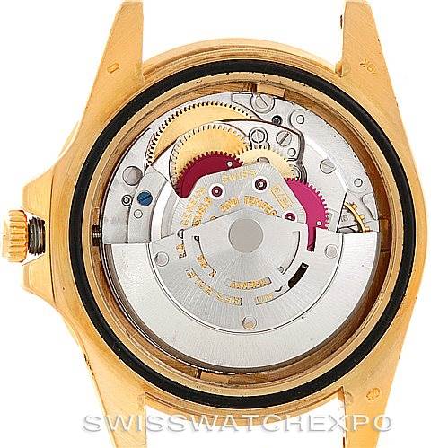 This image shows the internal mechanism of a Vintage Collection Rolex watch from the back angle.