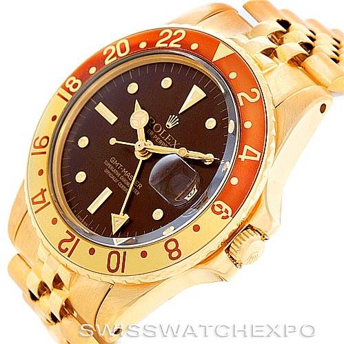 The image shows a close-up angled view of the Rolex Vintage Collection 1675 Men's Yellow Gold Brown Dial 1675 Men's Yellow Gold Brown Dial GMT-Master watch, highlighting the dial, bezel, and sections of the bracelet.