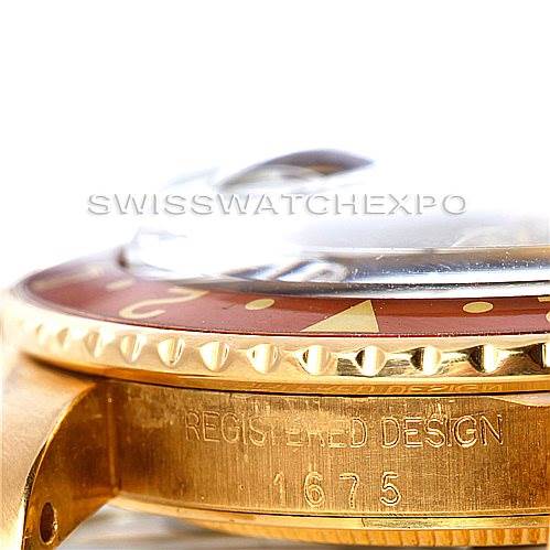 This close-up angle shows the side of a Vintage Collection Rolex watch, highlighting the bezel, part of the dial, and the case with an engraving.