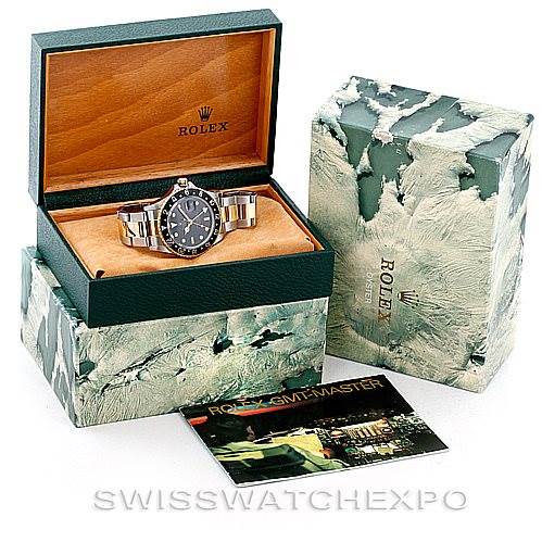 The image shows a Rolex Vintage Collection 16753 Men's Stainless Steel Black Dial 16753 Men's Stainless Steel Black Dial watch in an open case, with an outer box and a catalog booklet.