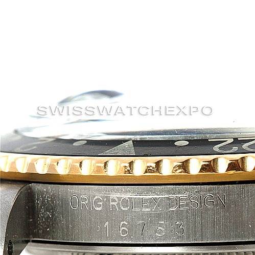 This image shows a close-up side view of a Vintage Collection Rolex watch, highlighting the bezel and the serial number.