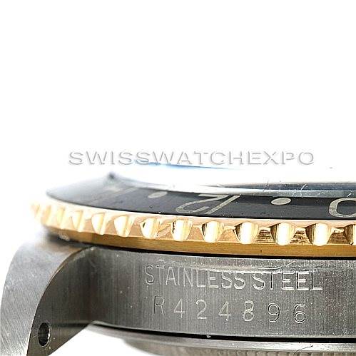 This image shows a close-up view of the side of a Rolex Vintage Collection 16753 Men's Stainless Steel Black Dial 16753 Men's Stainless Steel Black Dial watch, displaying its stainless steel case and serial number.