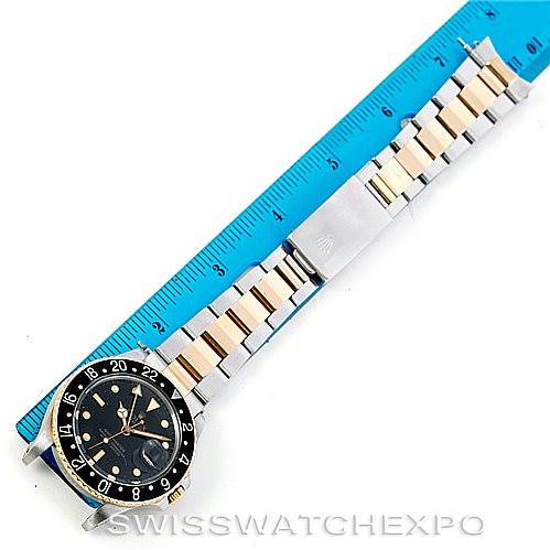 This image shows a Rolex Vintage Collection 16753 Men's Stainless Steel Black Dial 16753 Men's Stainless Steel Black Dial watch, displaying the full watch and bracelet alongside a blue ruler for size reference.