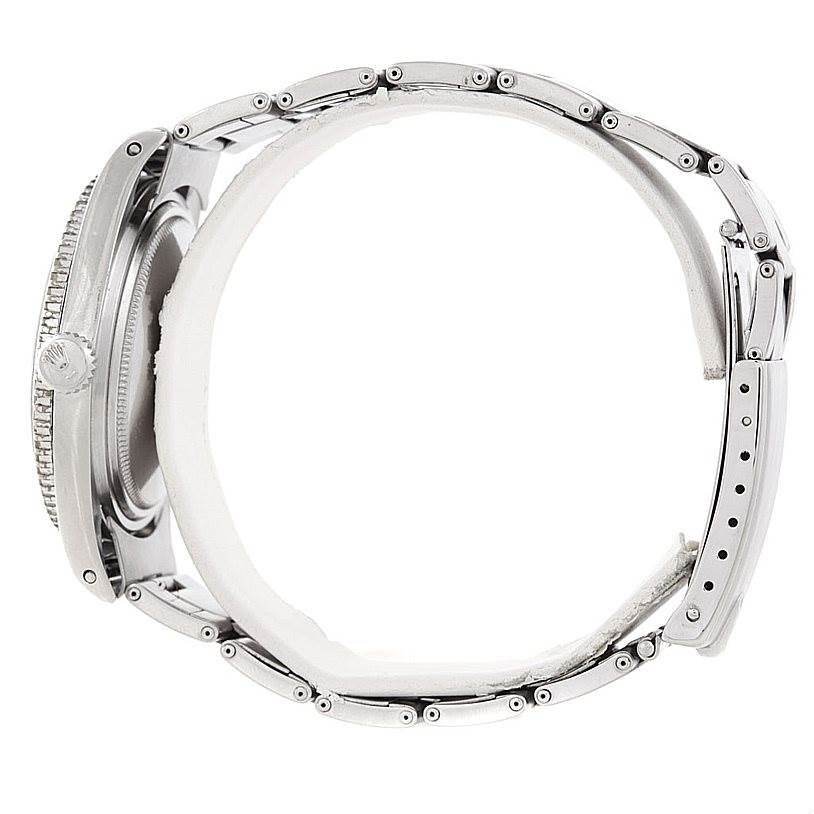 The image shows a side view of the Rolex Vintage Collection 5508 Men's Stainless Steel Black Dial 5508 Men's Stainless Steel Black Dial watch, highlighting its silver bracelet and case with a crown visible.