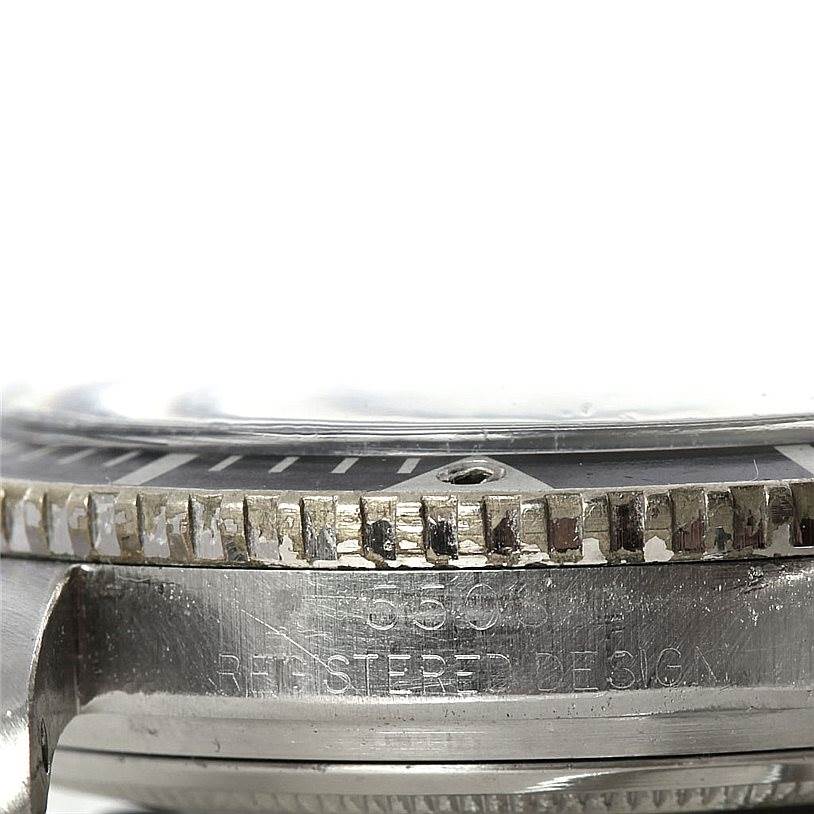 This close-up image of the Rolex Vintage Collection 5508 Men's Stainless Steel Black Dial 5508 Men's Stainless Steel Black Dial model focuses on the side case, bezel, and part of the crystal.