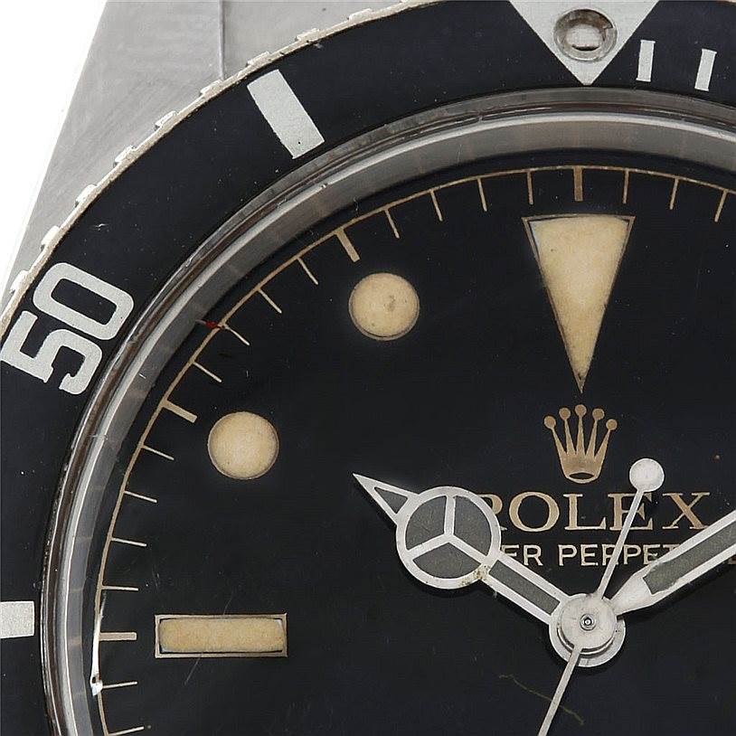 The image shows a close-up of the Rolex Vintage Collection 5508 Men's Stainless Steel Black Dial 5508 Men's Stainless Steel Black Dial watch face and bezel, emphasizing its detailing and markers.