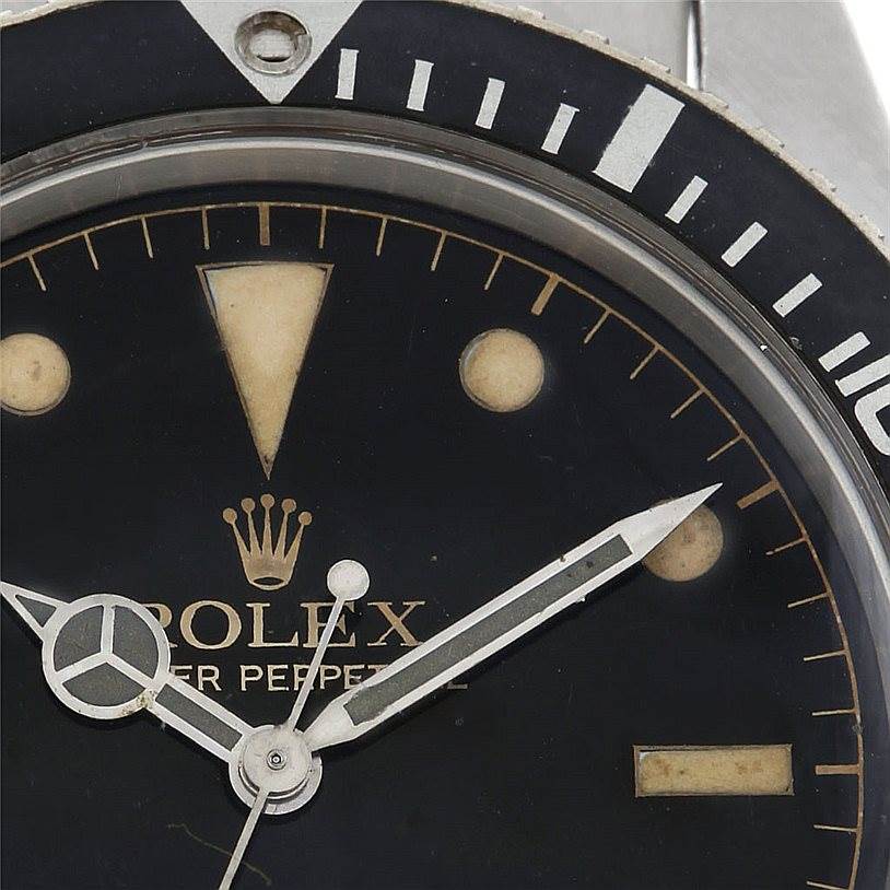 Close-up of the Rolex Vintage Collection 5508 Men's Stainless Steel Black Dial 5508 Men's Stainless Steel Black Dial watch, showing parts of the dial, hands, and bezel from a top-down angle.