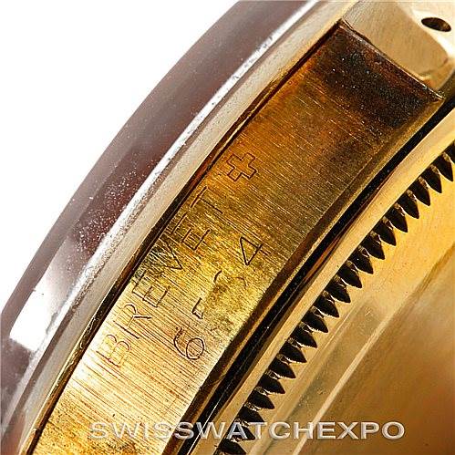 This image shows a close-up of the side of a Vintage Collection Rolex watch, highlighting its polished edge and "BREVET+" engraving.
