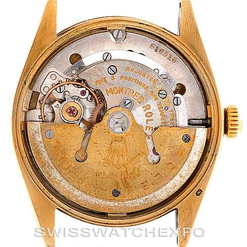 The image shows the inner mechanism and movement parts of the Rolex Vintage Collection 6564 Men's Yellow Gold Silver Dial 6564 Men's Yellow Gold Silver Dial watch from the back, with the caseback removed.