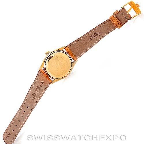 This is a back view of a Vintage Collection Rolex watch showing its case back, leather strap, and buckle.