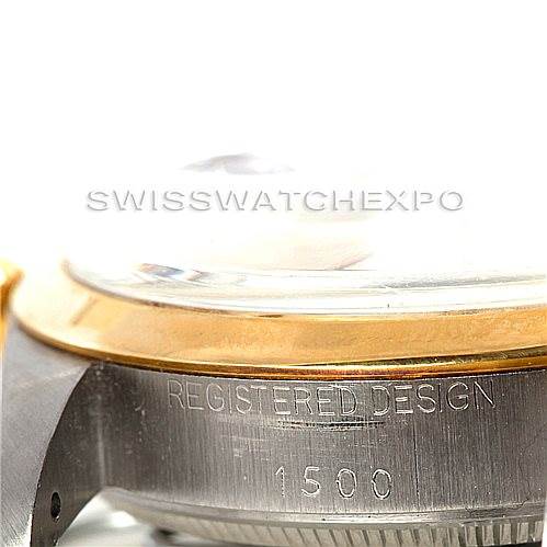 This close-up image of the Rolex Vintage Collection 1500 Men's Steel and Gold (two tone) Champagne Dial 1500 Men's Steel and Gold (two tone) Champagne Dial watch shows the side of the case with the "REGISTERED DESIGN 1500" engraving.