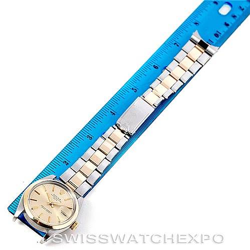 This image shows a Vintage Collection Rolex watch laid flat next to a ruler, displaying the face, bracelet, and clasp.