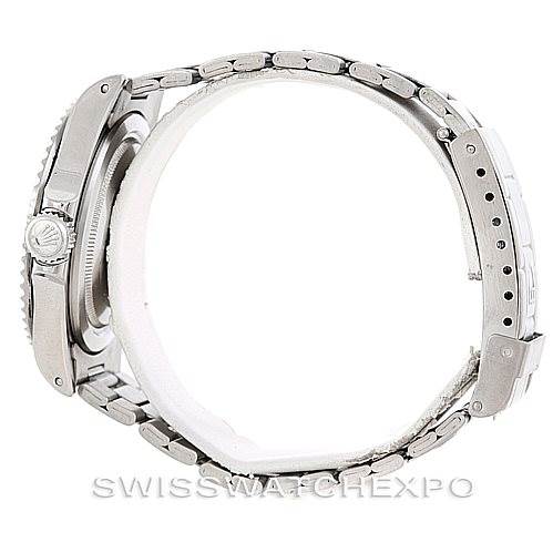 The image shows a side view of the Tudor Submariner 79190 Men's Stainless Steel Black Dial 79190 Men's Stainless Steel Black Dial watch, highlighting its case, bezel, crown, and metal bracelet.