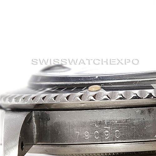The image shows a close-up side view of the Tudor Submariner 79090 Men's Stainless Steel Black Dial 79090 Men's Stainless Steel Black Dial watch, focusing on the case, bezel, and partial serial number.