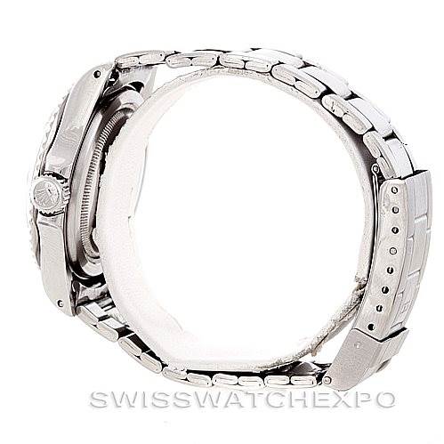 The Tudor Submariner 79090 Men's Stainless Steel Black Dial 79090 Men's Stainless Steel Black Dial watch shown is viewed from the side, featuring the crown, case, and bracelet with the clasp visible.