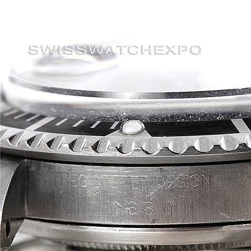 The image shows a close-up side view of the bezel, crystal, and part of the case of a Rolex Vintage Collection 1680 Men's Stainless Steel Black Dial 1680 Men's Stainless Steel Black Dial watch.