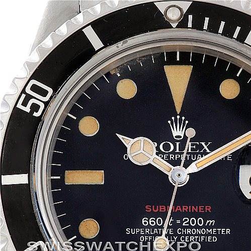 This image shows a close-up of the dial and bezel of a Vintage Collection Rolex Submariner, highlighting the markers and logo.