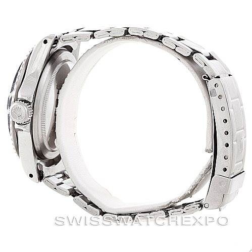 This image shows a side view of a Rolex Vintage Collection 1680 Men's Stainless Steel Black Dial 1680 Men's Stainless Steel Black Dial watch, displaying its crown, case, and metal bracelet.