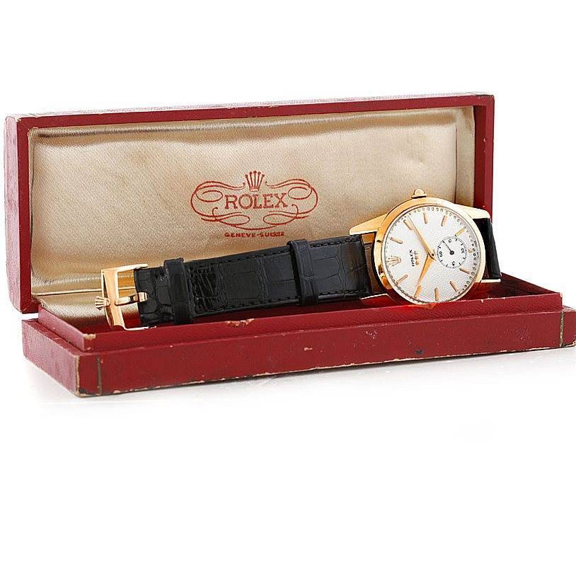 This image shows a Rolex Vintage Collection 8405 Men's Rose Gold Silver Dial 8405 Men's Rose Gold Silver Dial watch with a black leather strap, positioned diagonally in a red presentation box.