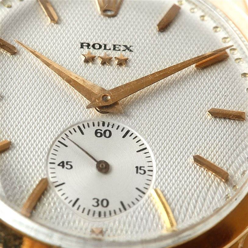 This image shows a close-up of the face of a Rolex Vintage Collection 8405 Men's Rose Gold Silver Dial 8405 Men's Rose Gold Silver Dial watch, highlighting the hands, indices, and a small seconds subdial.