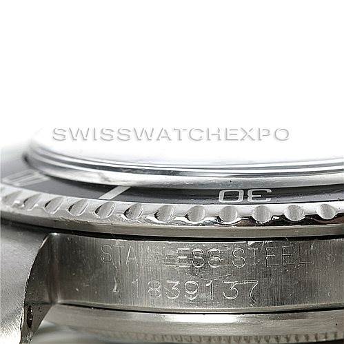 This image shows a close-up side angle of the bezel and part of the case of a Vintage Collection Rolex watch.