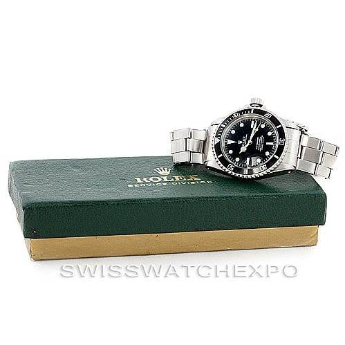 The Rolex Vintage Collection 5512 Men
s Stainless Steel  5512 Men
s Stainless Steel  watch is displayed at an angle resting on a green and gold Rolex service box.