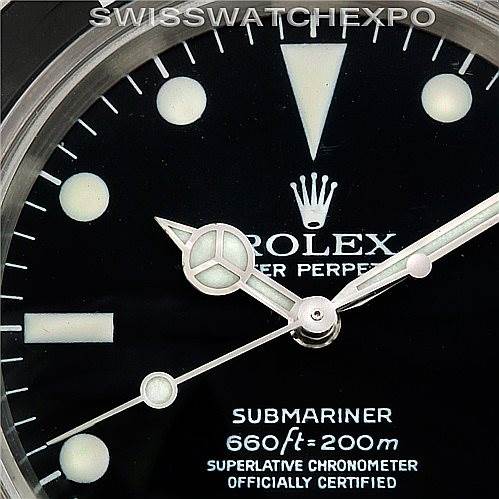 The image shows a close-up of the dial of a Rolex Vintage Collection 5512 Men
s Stainless Steel  5512 Men
s Stainless Steel  Submariner, highlighting the hands, markers, and branding.
