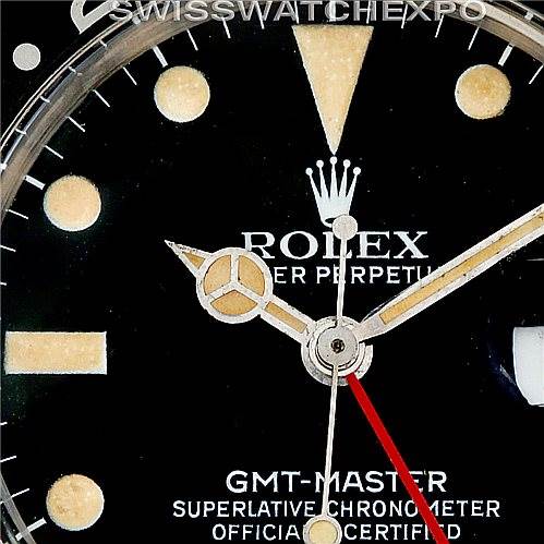 This close-up angle of the Rolex Vintage Collection 16750 Men's Stainless Steel Black Dial 16750 Men's Stainless Steel Black Dial GMT-Master model showcases its black dial, hands, and some hour markers.