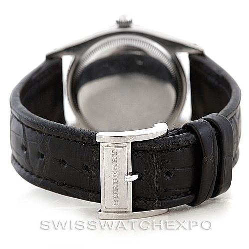 The image shows the backside of a Rolex Vintage Collection 6202 Men's Stainless Steel Black Dial 6202 Men's Stainless Steel Black Dial watch, featuring a black leather strap and metal buckle.