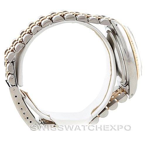 The image shows a side view of the Rolex Vintage Collection 16013 Men's Stainless Steel Champagne Dial 16013 Men's Stainless Steel Champagne Dial watch, highlighting its band, clasp, and case edge.