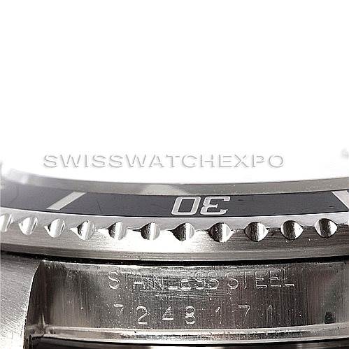 The image shows a close-up of the bezel and case side of the Rolex Vintage Collection 16800 Men's Stainless Steel Black Dial 16800 Men's Stainless Steel Black Dial watch, highlighting "Stainless Steel" and the serial number.