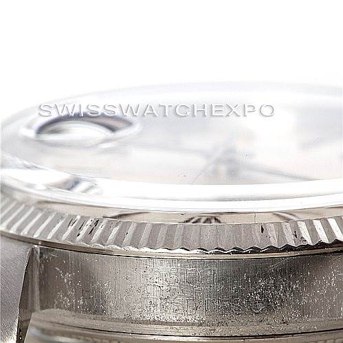 This close-up image of the Rolex Vintage Collection 1603 Men's Stainless Steel Silver Dial 1603 Men's Stainless Steel Silver Dial watch shows the side of the case and the edge of the crystal.