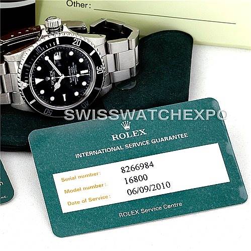 The image shows a Rolex Vintage Collection 16800 Men's Stainless Steel Black Dial 16800 Men's Stainless Steel Black Dial watch, focusing on the face and bracelet, along with an International Service Guarantee card.