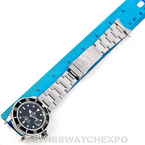 The image shows a Rolex Vintage Collection 16800 Men's Stainless Steel Black Dial 16800 Men's Stainless Steel Black Dial model watch placed next to a ruler, displaying the full watch including the dial and bracelet.