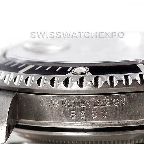 The image shows a close-up side view of a Vintage Collection Rolex watch, highlighting the bezel and engraved case design.
