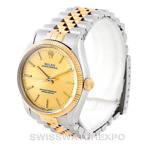 The image shows the Rolex Vintage Collection 1005 Men's Stainless Steel Champagne Dial 1005 Men's Stainless Steel Champagne Dial watch from a front-right angle, highlighting the dial, bezel, and bracelet.