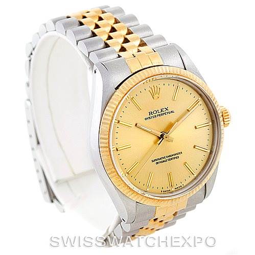 The image shows a Rolex Vintage Collection 1005 Men's Stainless Steel Champagne Dial 1005 Men's Stainless Steel Champagne Dial model watch at an angled side view, highlighting its bezel, dial, and bracelet.