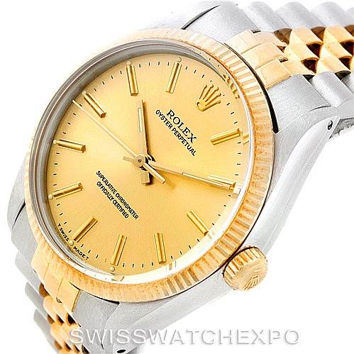 The image shows a close-up of the Rolex Vintage Collection 1005 Men's Stainless Steel Champagne Dial 1005 Men's Stainless Steel Champagne Dial watch, highlighting the dial, bezel, crown, and part of the bracelet from a side angle.