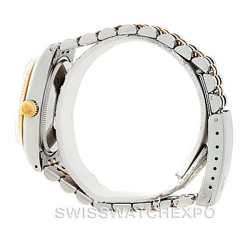 Side view of a Rolex Vintage Collection 1005 Men's Stainless Steel Champagne Dial 1005 Men's Stainless Steel Champagne Dial watch showing the case, crown, and partial bracelet with clasp.