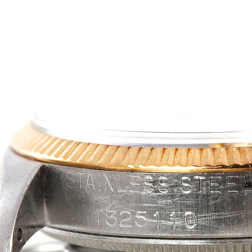 The image shows a close-up of the stainless steel case and the fluted bezel of the Rolex Vintage Collection 5501 Men's Steel and Gold (two tone) Silver Dial 5501 Men's Steel and Gold (two tone) Silver Dial watch.