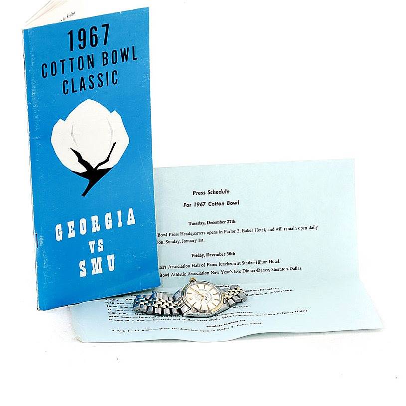 A Vintage Collection model by Rolex is shown lying flat with its stainless steel bracelet and dial visible.