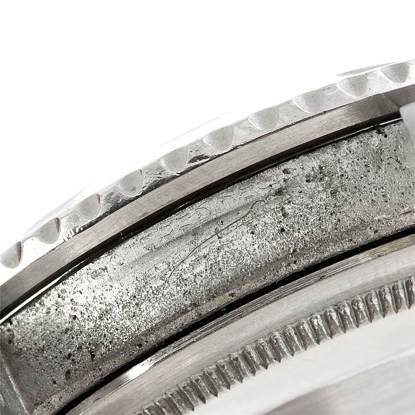 This close-up image shows the bezel and a portion of the case from the Rolex Vintage Collection 1675 Men's Stainless Steel Black Dial 1675 Men's Stainless Steel Black Dial watch.