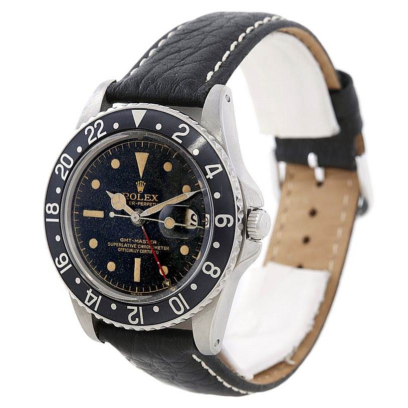 The image shows a Rolex Vintage Collection 1675 Men's Stainless Steel Black Dial 1675 Men's Stainless Steel Black Dial GMT-Master watch at an angled close-up, highlighting its face, bezel, and leather strap.