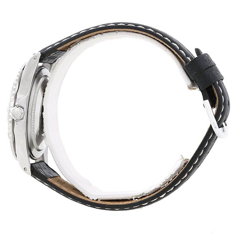 The image shows a side view of a Rolex Vintage Collection 1675 Men's Stainless Steel Black Dial 1675 Men's Stainless Steel Black Dial watch, focusing on the case, crown, and leather strap.